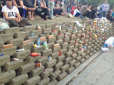 a-wall-of-free-food-drink-and-supplies-in-gezi-also-contains-antacid-for-tear-gas
